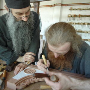 Father Avakum teaching Father Dimitrije wood carving 1