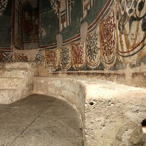 Masoned seats and sokl zone of the altar apse