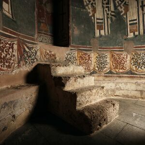 Masoned seats and sokl zone of the altar apse