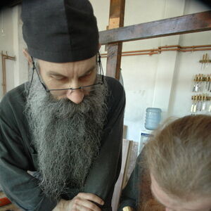 Father Avakum teaching Father Dimitrije wood carving 2