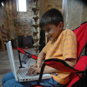 Stefan enojys playing games on his Mac