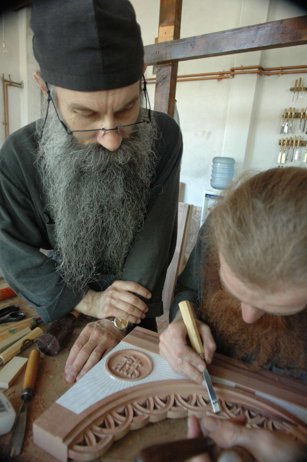 Father Avakum teaching Father Dimitrije wood carving 2