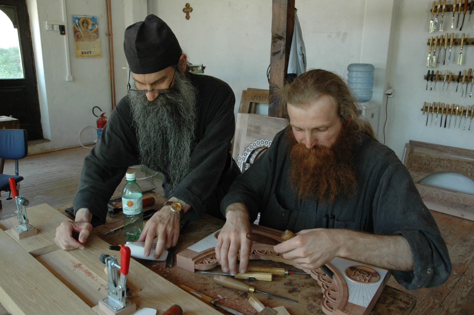 Father Avakum teaching Father Dimitrije wood carving 8