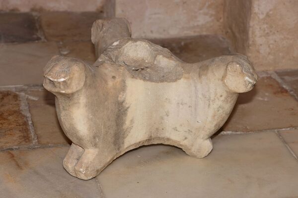 Candlestick base with three lion busts