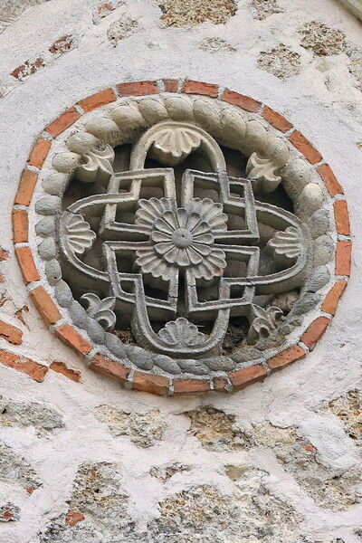 A small rosette on the north gable of the narthex