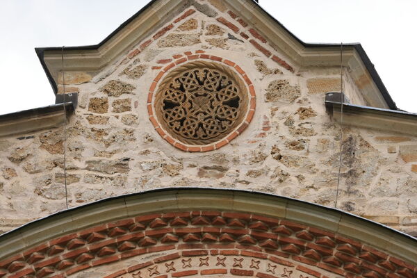 A small rosette on the south gable of the narthex