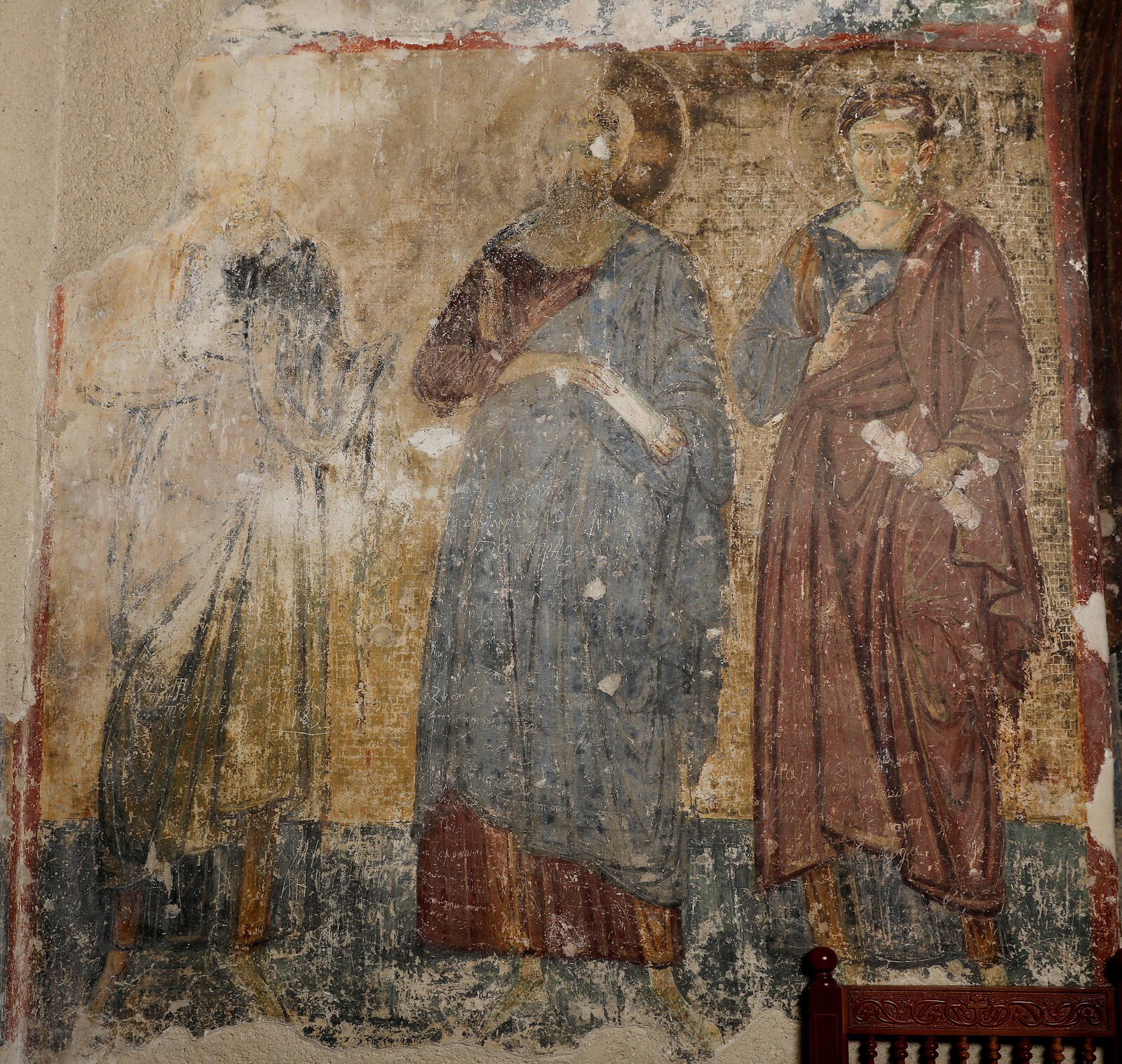 Two unidentified apostles and Apostle Thomas