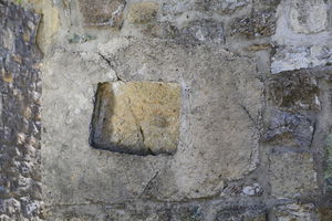 Камена сполија уграђена у северни зид источног травеја