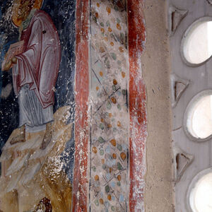 Ornamental band in the two-light window on the north wall