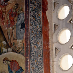 Ornamental band in the two-light window on the south wall