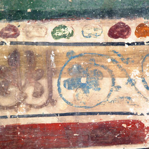 Ornamental band dividing first and second register of frescoes on the south wall