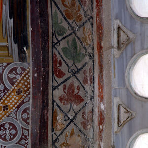 Ornamental band in the apse two-light window