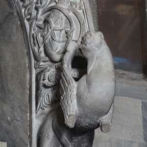 A sculpture of griffin on the capital on the south side of the portal