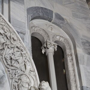 A sculpture of griffin on the capital on the south side of the portal