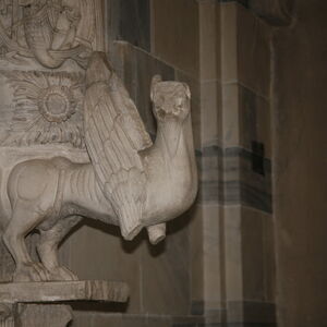 A sculpture of griffin on the capital on the south side of the portal