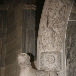 A sculpture of the lioness on the capital on the north side of the portal