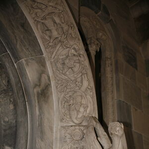 A sculpture of griffin on the capital on the south side of the portal