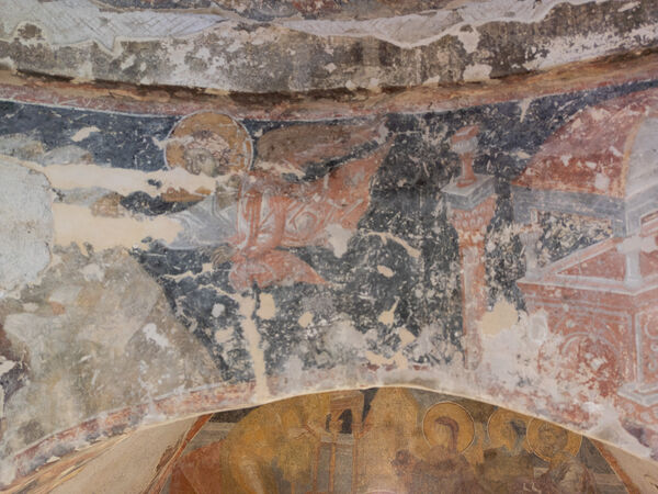 Angel and damaged figure of John the Evangelist
